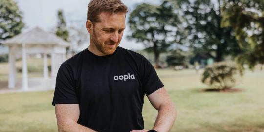 Support to Perform’s CEO Jonny Bloomfield uses his smartwatch to access the Oopla app.